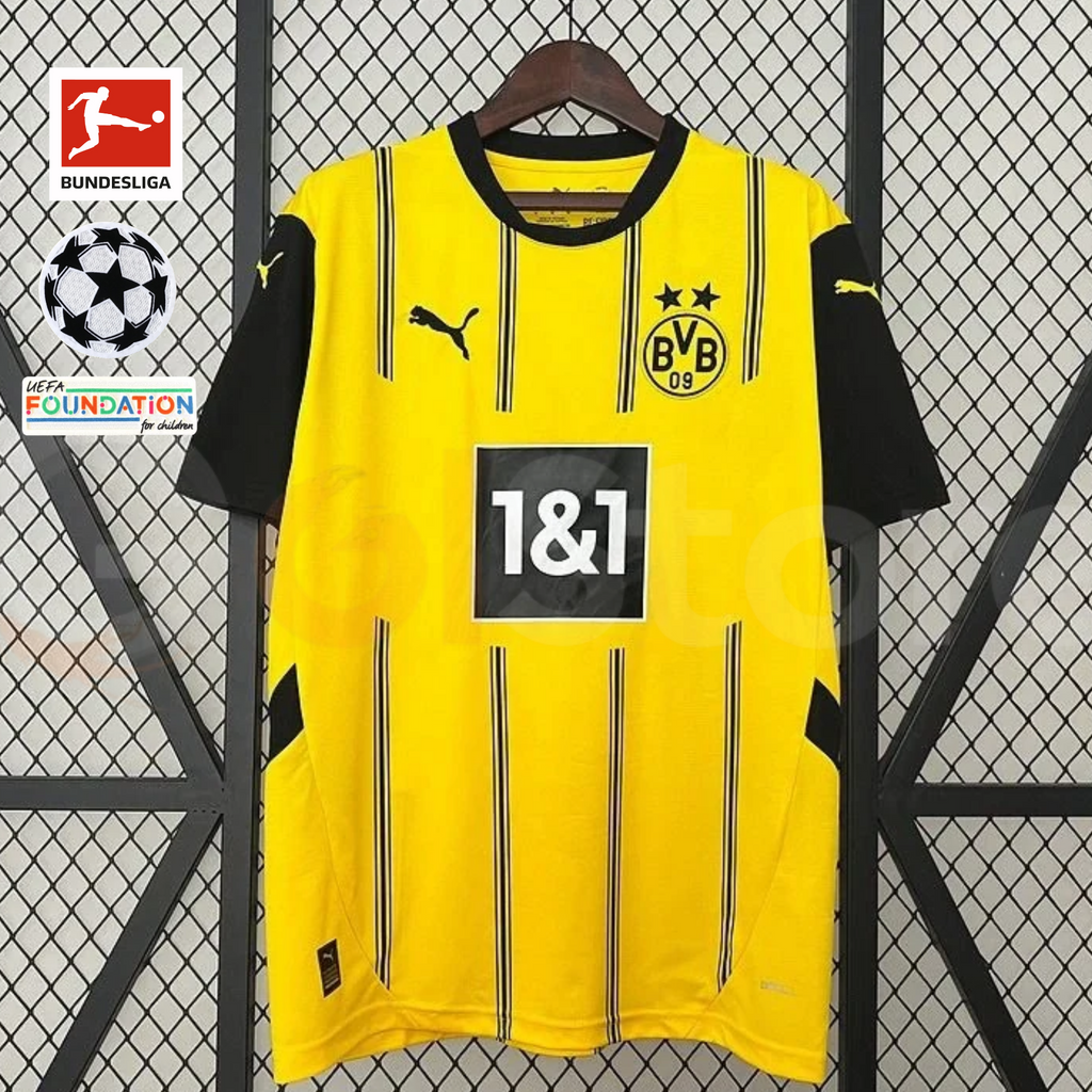 Borussia Dortmund yellow home jersey with black short sleeves, thin vertical stripes and 1&1 sponsor, alongside Bundesliga, UCL and UEFA Foundation graphics.
