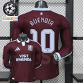 Front and back views of a claret Aston Villa long-sleeve jersey with a light blue collar, light blue Buendia number 10 print and Visit Rwanda sponsor.