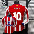 Front and back views of a red and white Atlético Madrid long-sleeve jersey with blue trim, white Álex B. number 10 print and Riyadh Air sponsor, alongside UCL graphics.