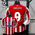 Front and back views of a red and white Atlético Madrid long-sleeve jersey with blue trim, white Sørloth number 9 print and Riyadh Air sponsor, alongside UCL graphics.