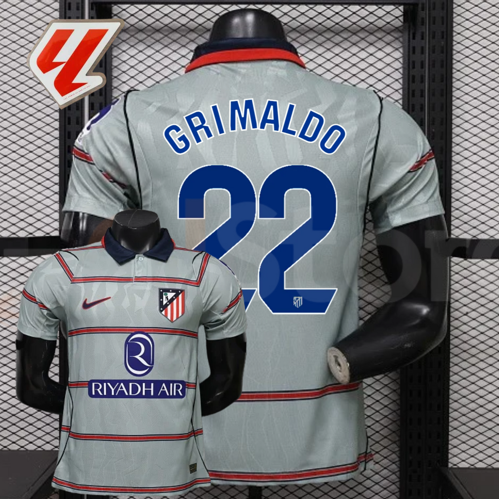 Front and back views of a light grey Atlético Madrid short-sleeve jersey with red horizontal stripes, blue Grimaldo number 22 print and Riyadh Air sponsor, alongside a LaLiga graphic.