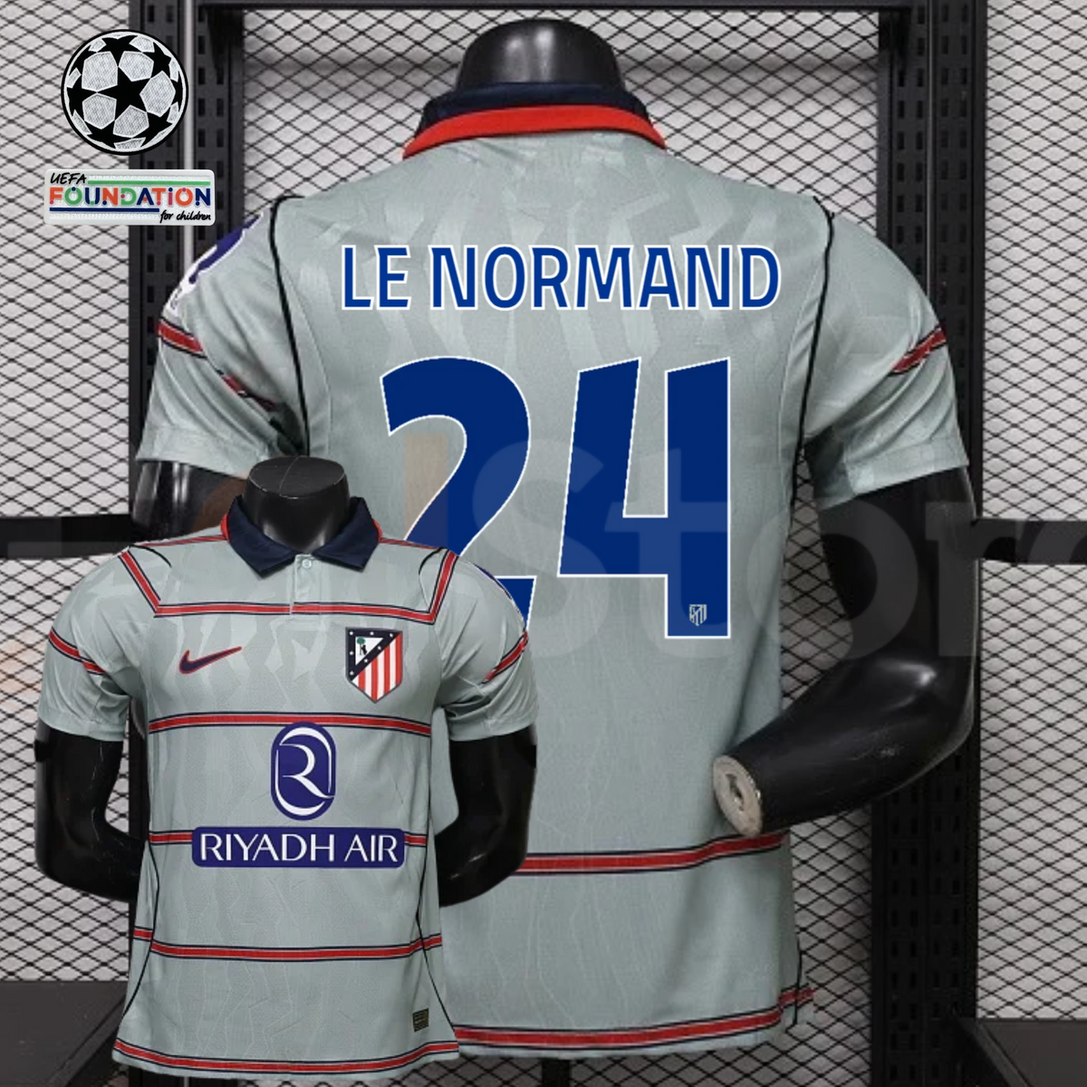  Front and back views of a light grey Atlético Madrid short-sleeve jersey with red horizontal stripes, blue Le Normand number 24 print and Riyadh Air sponsor, alongside UCL graphics.