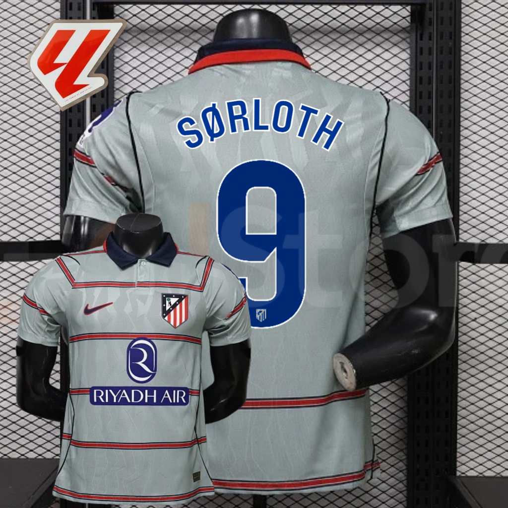 Front and back views of a light grey Atlético Madrid short-sleeve jersey with red horizontal stripes, blue Sørloth number 9 print and Riyadh Air sponsor, alongside a LaLiga graphic.