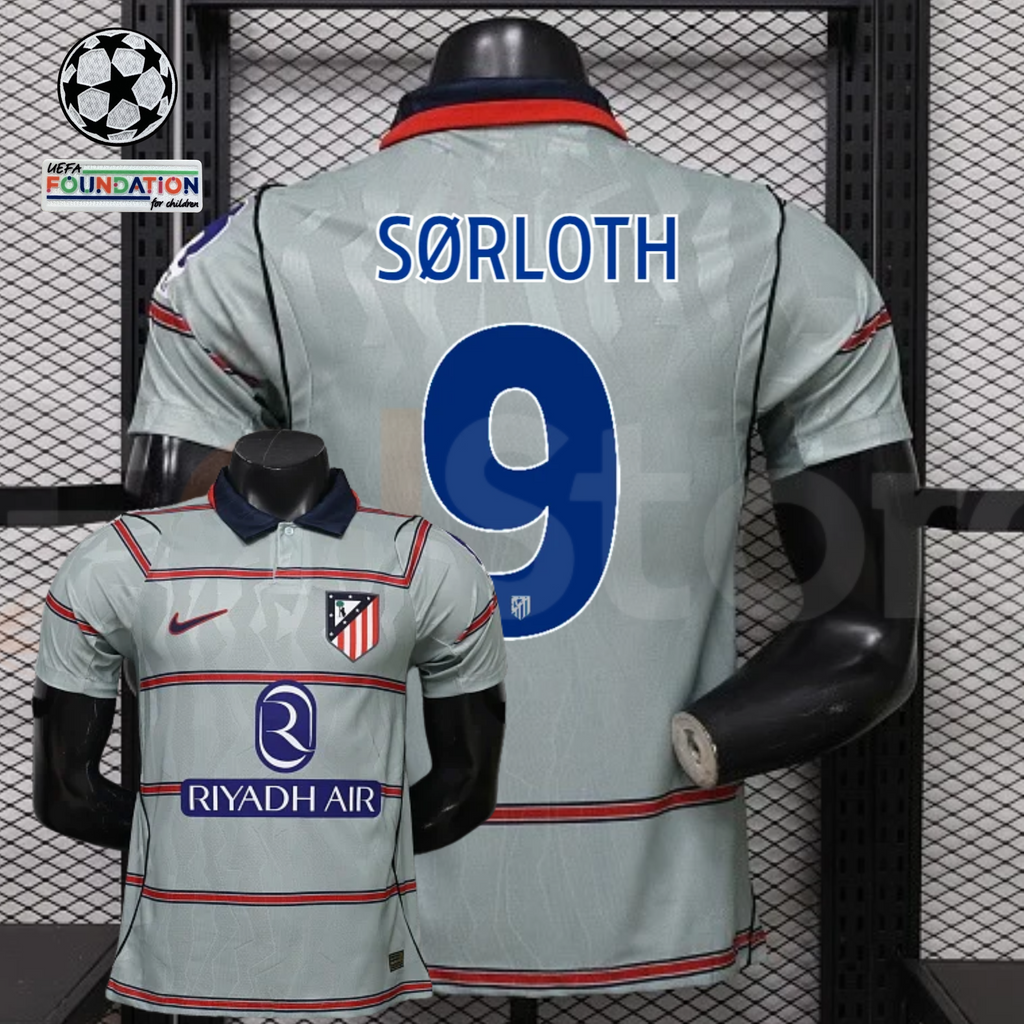 Front and back views of a light grey Atlético Madrid short-sleeve jersey with red horizontal stripes, blue Sørloth number 9 print and Riyadh Air sponsor, alongside UCL graphics.