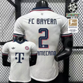 Front and back views of a white Bayern Munich short-sleeve away jersey with a navy collar, burgundy trim and navy Upamecano number 2 print.
