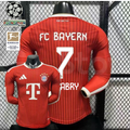  Front and back views of a red Bayern Munich long-sleeve home jersey with tonal stripes, white Gnabry number 7 print and Telekom sponsor, alongside UCL and Bundesliga badge graphics.