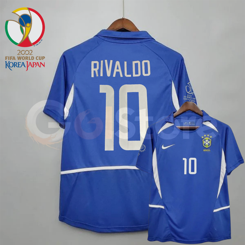 Front and back views of a blue Brazil 2002 retro short-sleeve away jersey with white panels, Rivaldo number 10 print, Brazil crest and World Cup sleeve patch.