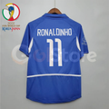Back view of a blue Brazil 2002 retro short-sleeve away jersey with white Ronaldinho number 11 print, white side panels and a World Cup sleeve patch.