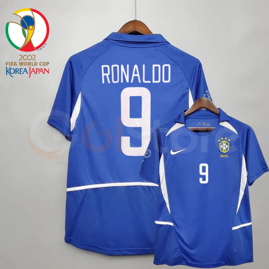 Front and back views of a blue Brazil 2002 retro short-sleeve away jersey with white panels, white Ronaldo number 9 print and Brazil crest.