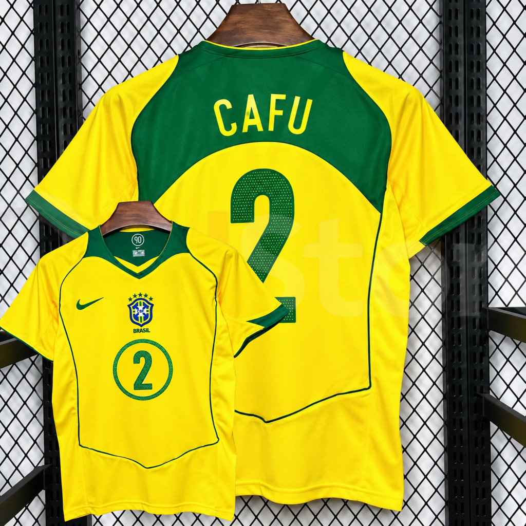 Front and back views of a yellow Brazil retro short-sleeve home jersey with green trim, yellow Cafu lettering on a green upper back panel and green number 2 print.