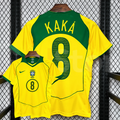 Front and back views of a yellow Brazil retro short-sleeve home jersey with green trim, yellow Kaká lettering on a green upper back panel and green number 8 print.