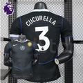 Front and back views of a black Chelsea FC short-sleeve third jersey with blue piping, white Cucurella number 3 print and a gold FIFA World Champions chest badge.