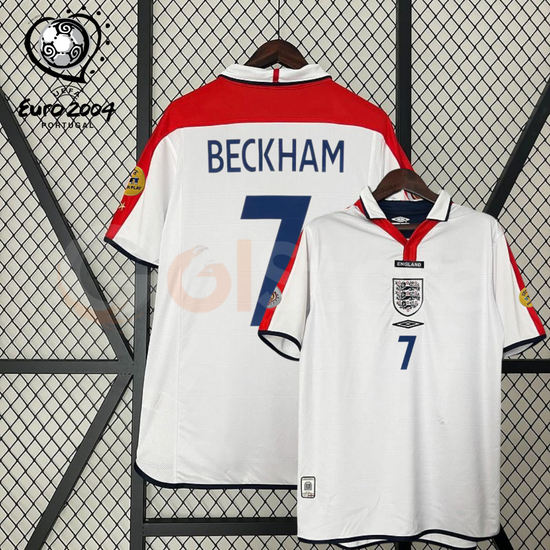 Front and back views of a white England short-sleeve retro jersey with red shoulder panels, dark blue Beckham number 7 print and sleeve patches, alongside a EURO 2004 graphic.