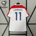 Back view of a white England short-sleeve retro jersey with red shoulder panels, dark blue Lampard number 11 print and sleeve patches, alongside a EURO 2004 graphic.
