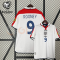 Front and back views of a white England short-sleeve retro jersey with red shoulder panels, dark blue Rooney number 9 print and sleeve patches, alongside a EURO 2004 graphic.