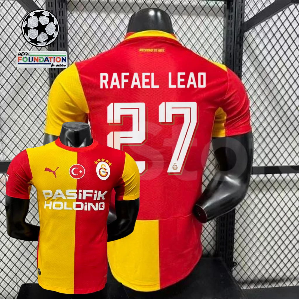 Front and back views of a red and yellow Galatasaray short-sleeve home jersey with white Rafael Leao number 27 print and Pasifik Holding sponsor.
