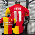 Front and back views of a red and yellow Galatasaray short-sleeve home jersey with white Yunus number 11 print and Pasifik Holding sponsor.