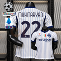 Front and back views of a white Inter Milan short-sleeve jersey with blue pinstripes, navy Mkhitaryan number 22 print and Betsson Sport sponsor, alongside UCL and Serie A graphics.
