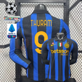  Front and back views of a blue and black striped Inter Milan long-sleeve jersey with yellow Thuram number 9 print, club crest and Betsson Sport sponsor, alongside UCL and Serie A