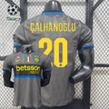 Front and back views of a grey Inter Milan short-sleeve third jersey with blue trim, yellow Çalhanoğlu number 20 print and Betsson Sport sponsor.