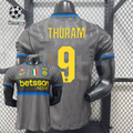 Front and back views of a grey Inter Milan short-sleeve third jersey with blue trim, yellow Thuram number 9 print and Betsson Sport sponsor.