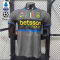 Front view of a grey Inter Milan short-sleeve third jersey with a black chest band, blue trim, yellow Betsson Sport sponsor and club crest.