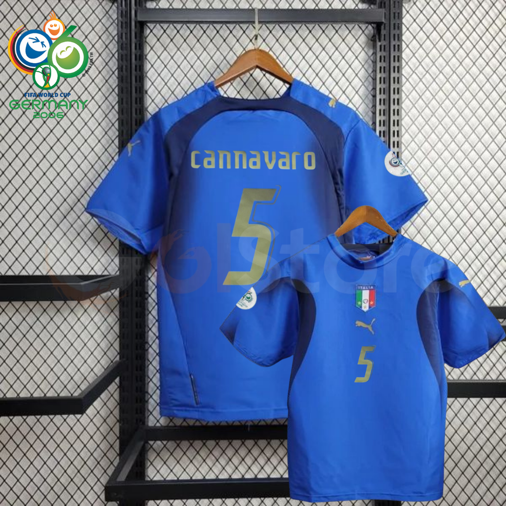 Front and back views of a blue Italy short-sleeve retro home jersey with dark panels, gold Cannavaro number 5 print and sleeve patches, alongside a Germany 2006 World Cup graphic.