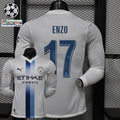 Front and back views of a white Manchester City long-sleeve jersey with blue central stripes, blue Enzo number 17 print and Etihad Airways sponsor, alongside UCL graphics.