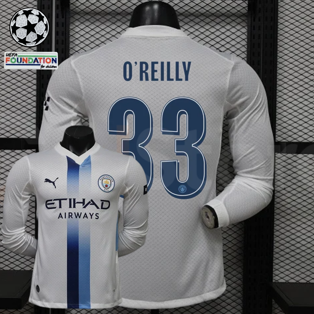 Front and back views of a white Manchester City long-sleeve jersey with blue central stripes, blue O’Reilly number 33 print and Etihad Airways sponsor, alongside UCL graphics.
