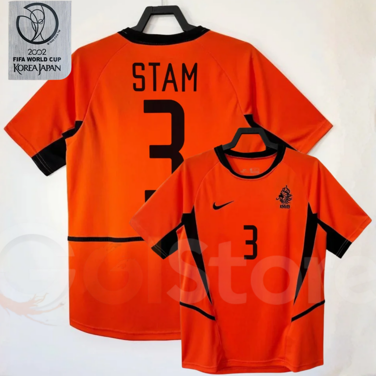 Netherlands orange short-sleeve retro jersey, front and back views with STAM 3 print, black collar and side panels, alongside a 2002 World Cup graphic.
