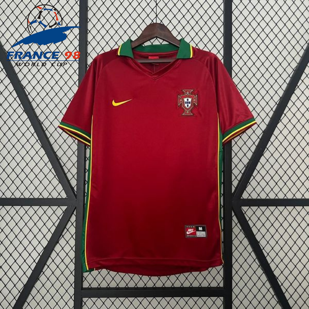 Front view of a red Portugal retro short-sleeve home jersey with a green collar, green sleeve trim, yellow accents and Portugal crest.