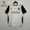 Front view of a white Valencia CF retro short-sleeve jersey with black sleeves, red Toyota sponsor and UEFA Cup Final Göteborg 2004 chest lettering.